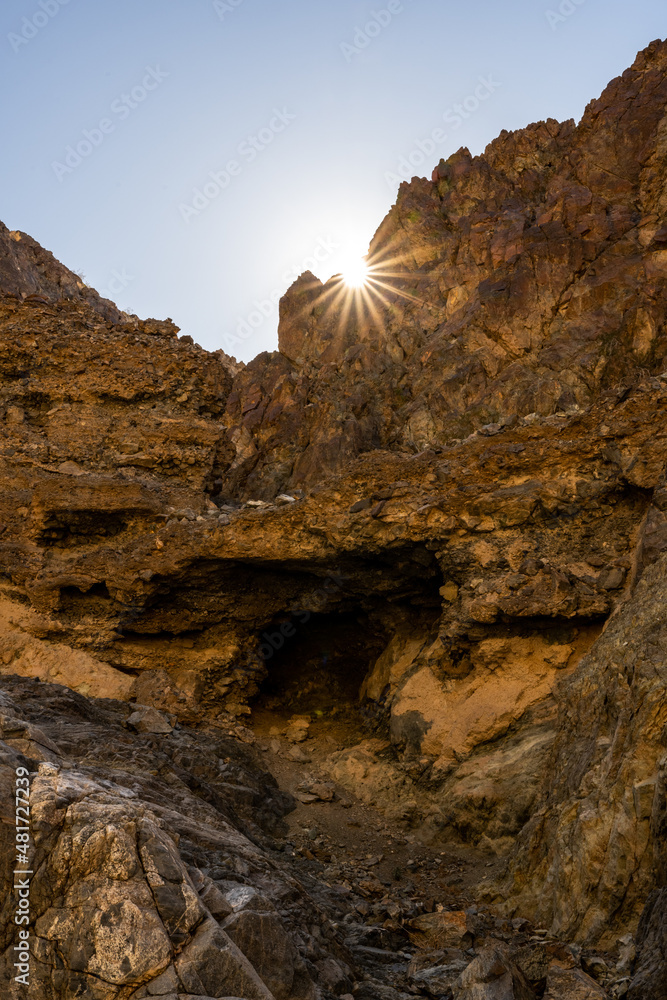 Sunburst Breaks The Rocky Ridge In Death Valley