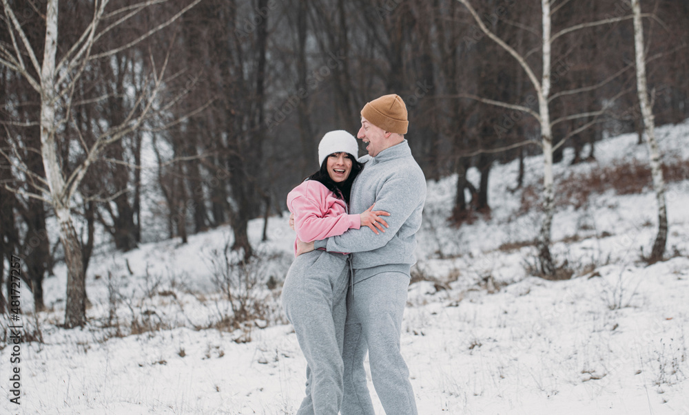 couple in park. Winter couple. Happy day. Snow background. Sensual. Love. couple in park. Winter couple. Happy day. Snow background. Sensual. Love.