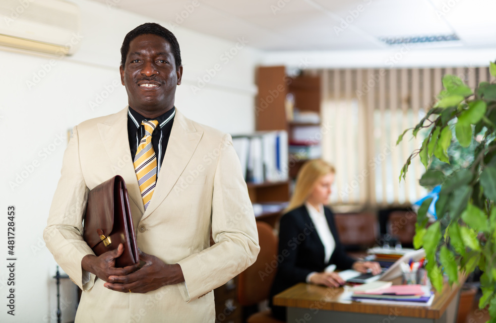 Fototapeta premium Portrait of successful and confident male businessman in the office