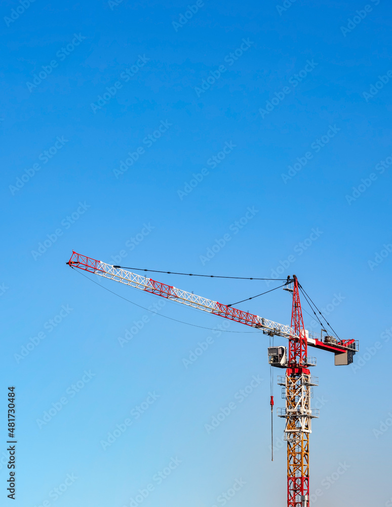 Tower crane on the construction site of the residential apartment building