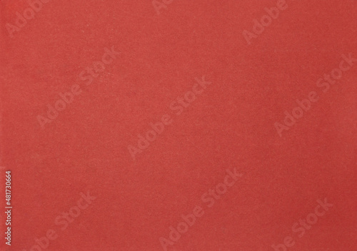 Slika na platnu Red paperboard textured background, center lit.