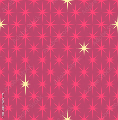 Mid-century modern wrapping paper with starburst pattern in red and gold
