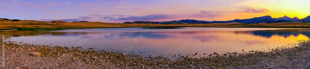 sunset over the mountain lake