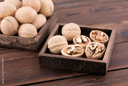 Dried walnuts are in a wooden box