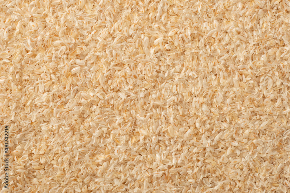 Full frame food background of whole psyllium husk, top view. Full frame food background of whole psyllium husk, top view.