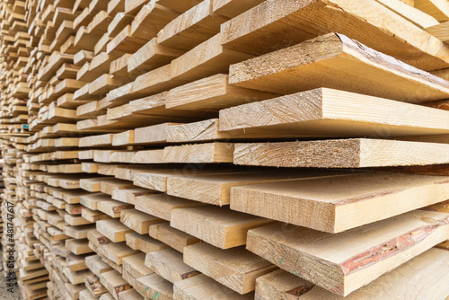 Photography Perspective angle of wooden planks in close-up at a lumber warehouse