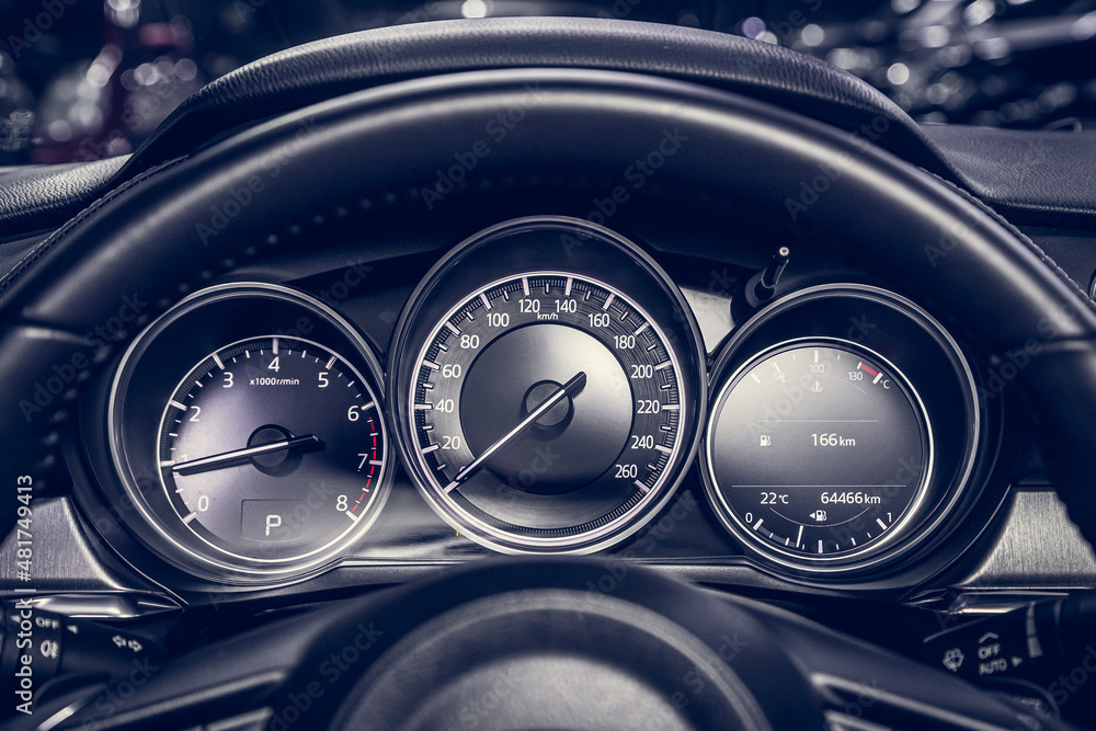 close up of the speedometer with rpm and km meter