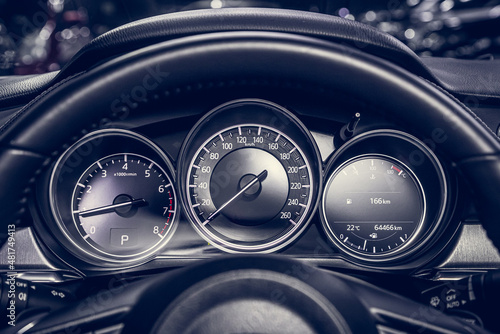 close up of the speedometer with rpm and km meter