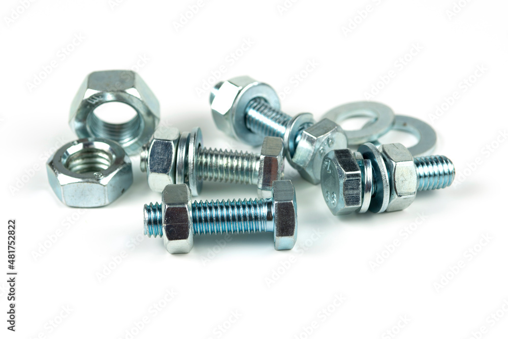 metal bolts and nuts with round washers close-up on a white background metal bolts and nuts with round washers close-up on a white background