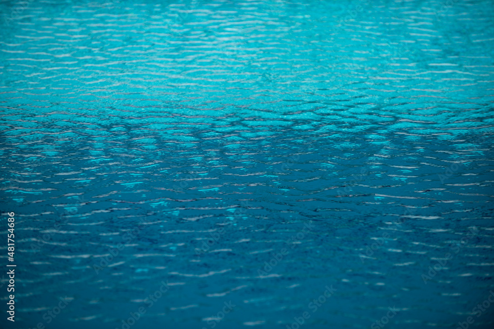 Blue ripped water in swimming pool, water pool texture and surface water backgraund.