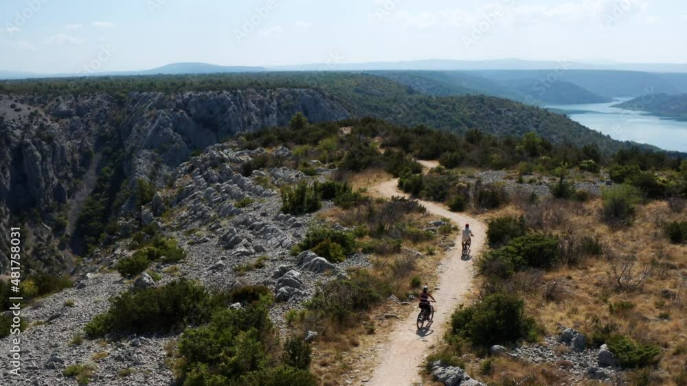 Cyclists Driving Towards The Viewpoint In The Scenic Krka National Park, Croatia - aerial drone shot Cyclists Driving Towards The Viewpoint In The Scenic Krka National Park, Croatia - aerial drone shot