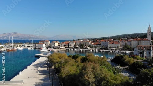 Supetar harbor, aerial lift with pan. photo