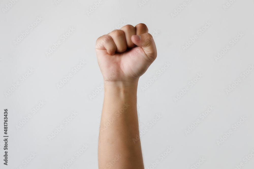 Man fist up isolated on white background success or strength Man fist up isolated on white background success or strength