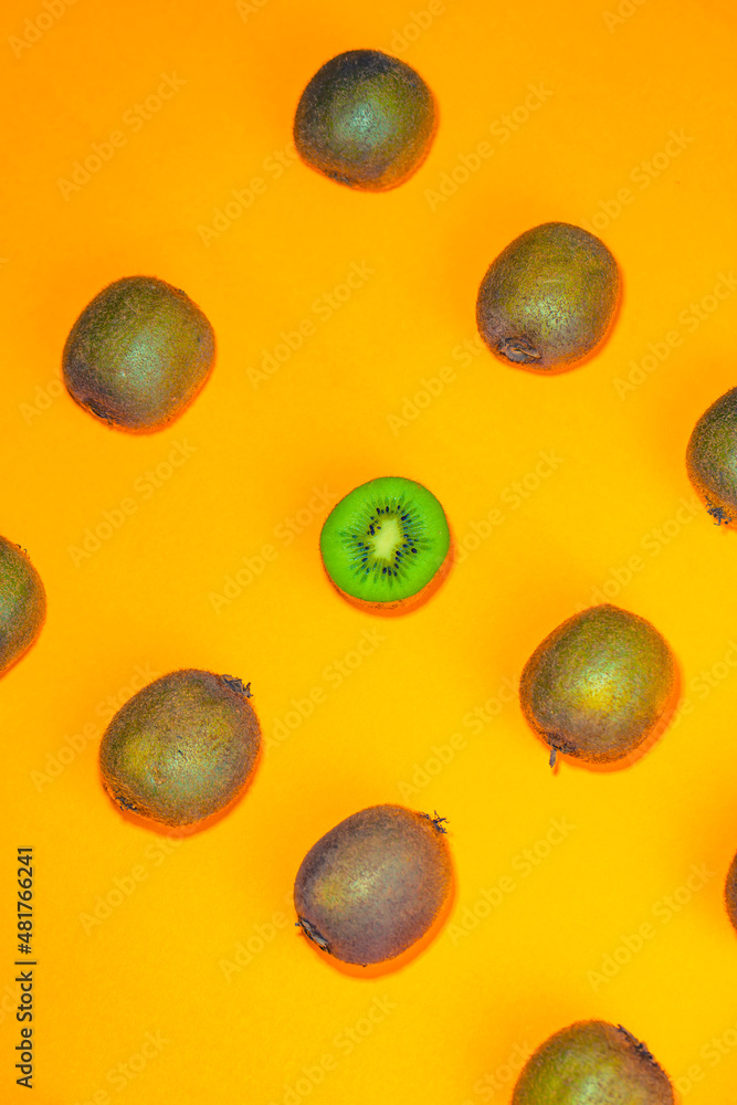 kiwi fruit on orange background kiwi fruit on orange background