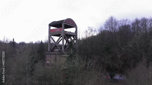 Aerial shot of an abonded steel factory in a forest in normandy photo