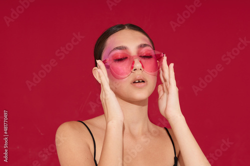 fashionable woman bright makeup posing fashion emotions fashion glasses close-up unaltered