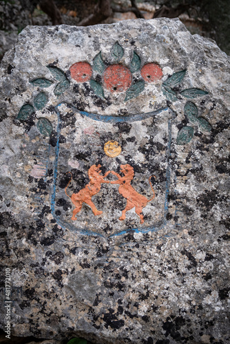 polychrome Sóller heraldic shield carved on a rock, Camí dels Alous, Soller, Mallorca, Balearic Islands, Spain