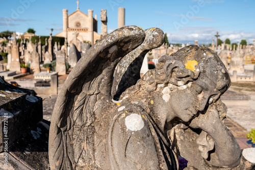 sad angel, work of Tomàs Vila, Llucmajor cemetery, Mallorca, Balearic Islands, Spain photo