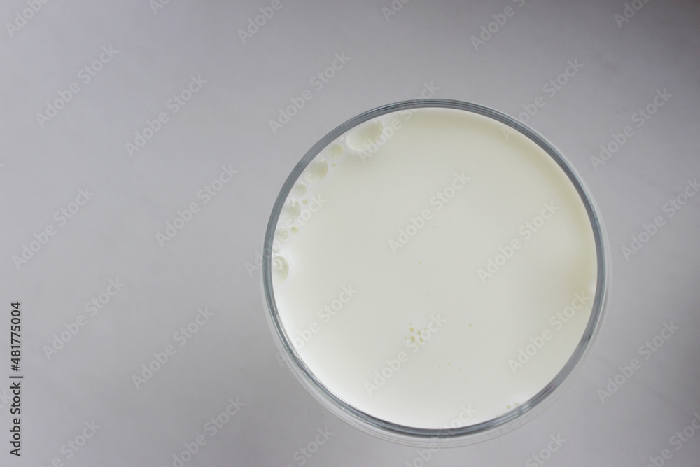 glass of milk on white background top view glass of milk on white background top view