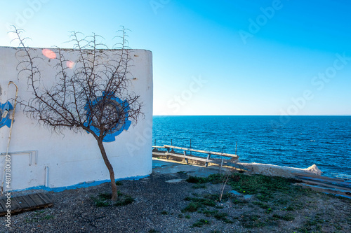 An abandoned house on the edge of the cliff on the old island of Tabarca, in the Spanish Mediterranean, in front of Santa Pola, Alicante
