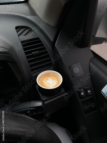 a cup of coffee in the car