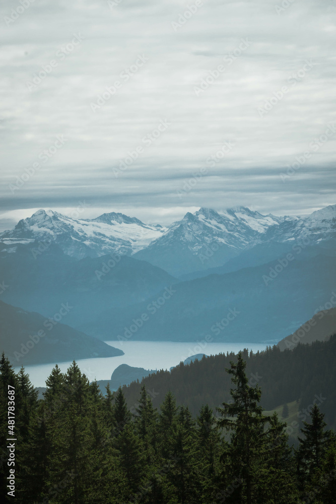 Lake Thun, Bern, Switzerland. Thunersee with Snowy Swiss Alps in the Background.