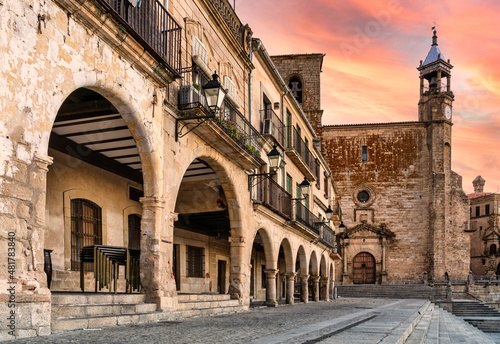 view of the arches and church from the main square of Trujillo, Extremadura, Spain - sunset sky. photo