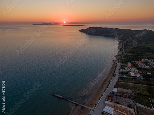 Aerial drone view of beautiful sunset in arillas beach Mathraki and Othoni corfu greece