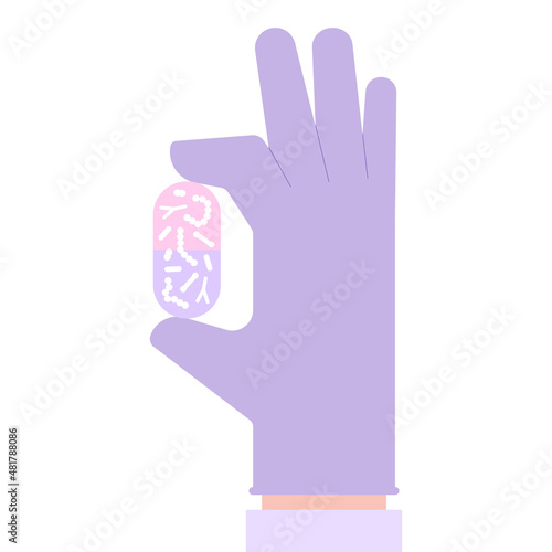 Probiotic bacteria capsule in hand. Good microbiota nutrition supplement in pill. Lactobacillus, acidophilus, bifidobacteria and other microorganisms for biotechnology.