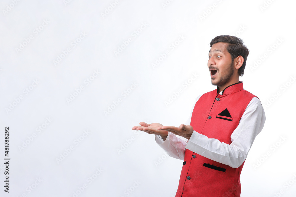 Young indian farmer in traditional wear and giving expression on white background. Young indian farmer in traditional wear and giving expression on white background.