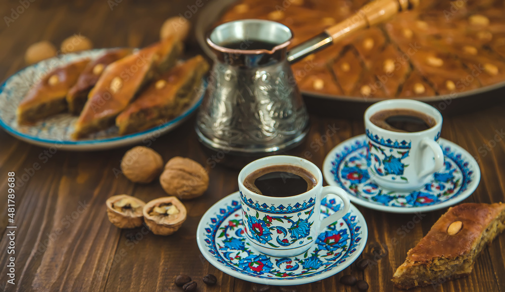 Fototapeta premium Baklava on the table and Turkish coffee. Selective focus.