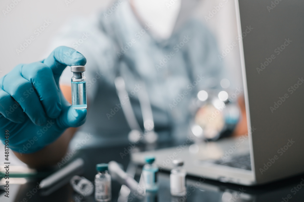 A doctor or scientist in the COVID-19 medical vaccine research and development laboratory holds a syringe with a liquid vaccine to study and analyze antibody samples for the patient.
A doctor or scientist in the COVID-19 medical vaccine research and development laboratory holds a syringe with a liquid vaccine to study and analyze antibody samples for the patient.