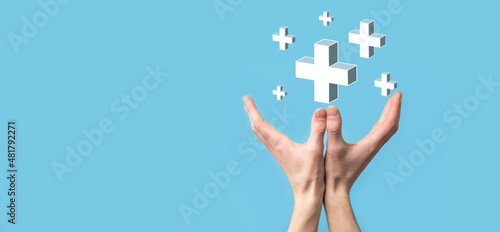 Hand hold 3D plus icon, man hold in hand offer positive thing such as profit, benefits, development, CSR represented by plus sign.The hand shows the plus sign