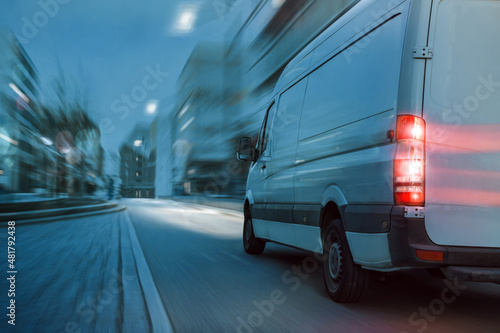 Photos Fast delivery truck driving in the city at night