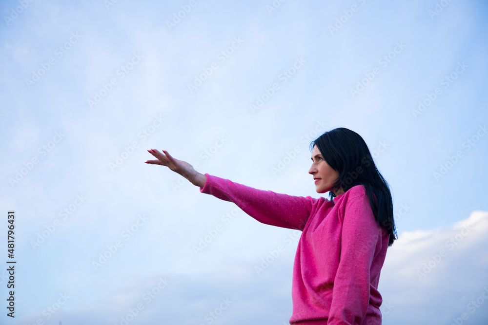 Woman life. Gesture. Happy day. Lifestyle. Happy. Sky background. Woman life. Gesture. Happy day. Lifestyle. Happy. Sky background.