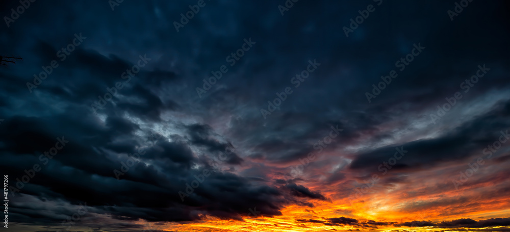 Dramatic sunset scene of the dark overcast sky. Fantastic view of stormy sky.