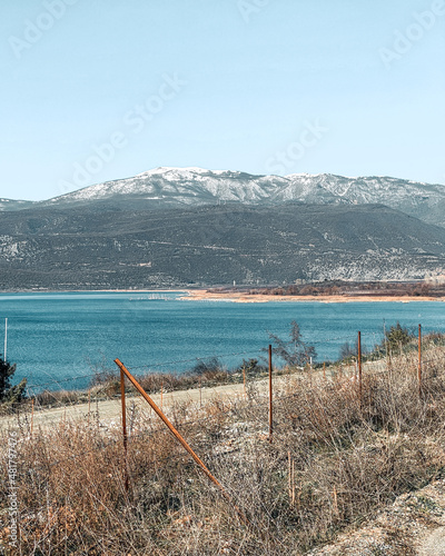 Panoramic view of the lake Vegoritida in Pella, Greece with Voras mountain on the background covered in the top with snow  photo