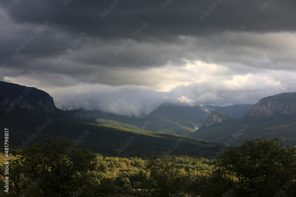 Beautiful summer landscape with mountain and forest views in a mountain valley Beautiful summer landscape with mountain and forest views in a mountain valley
