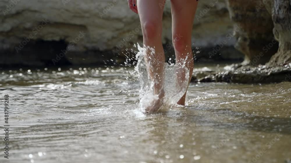 Woman walking on beach slow motion Woman walking on beach slow motion