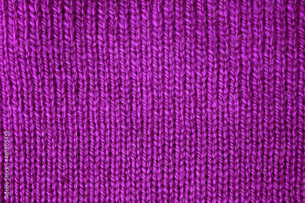 Purple jersey lies on the table. View from above Purple jersey lies on the table. View from above