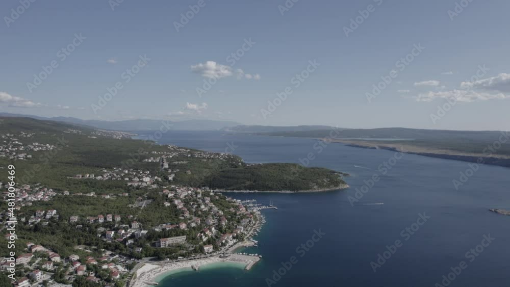 Video with Front Plane Drone advancing over the coast of Jadranovo in Croatia, clear sky with some clouds, you can see a pier with boats on the shore. Video with Front Plane Drone advancing over the coast of Jadranovo in Croatia, clear sky with some clouds, you can see a pier with boats on the shore.