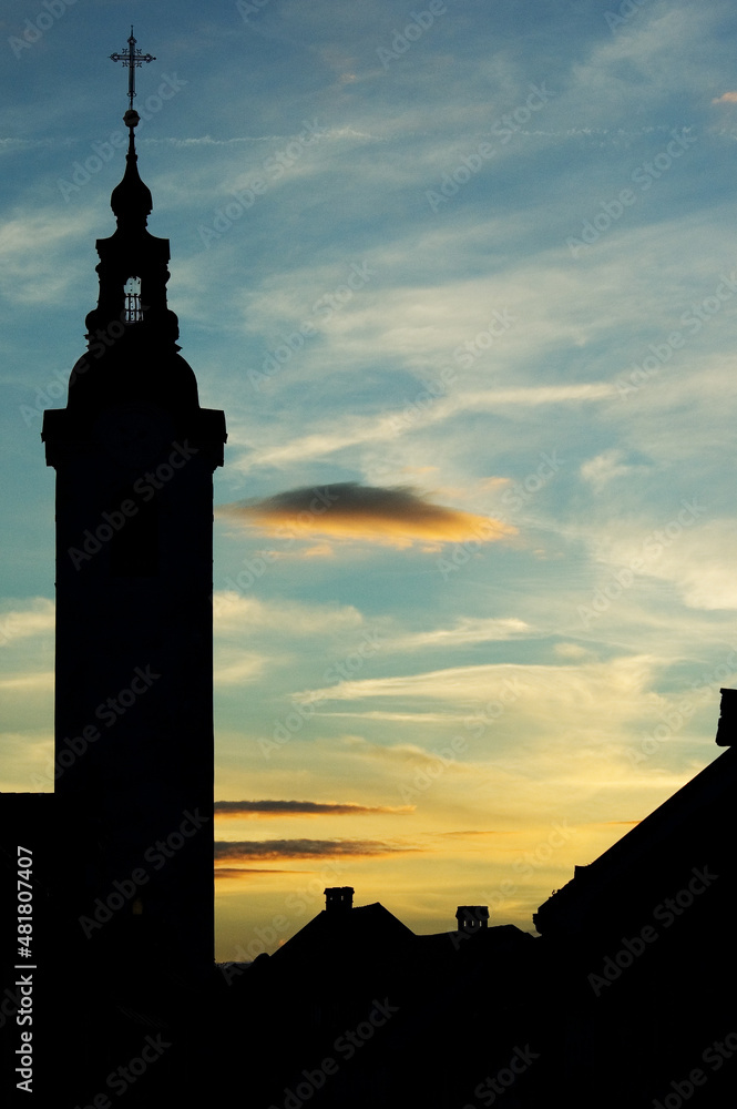 Silhouette of catholic church on evening sky background