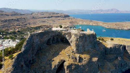Lindos small whitewashed village and the Acropolis, scenery of Rhodos Island at Aegean Sea