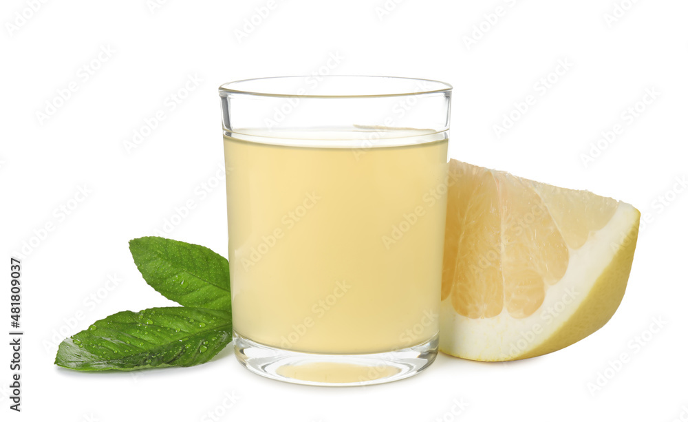 Glass of fresh pomelo juice, fruit and green leaves isolated on white Glass of fresh pomelo juice, fruit and green leaves isolated on white