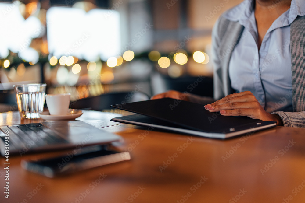 Closeup picture of elegant woman, putting down the menu, ready to order. Closeup picture of elegant woman, putting down the menu, ready to order.