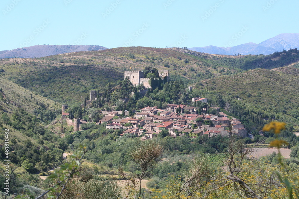 Landscape view of the beautiful medieval village of Castelnou in the Pyrenees Orientales region of France.