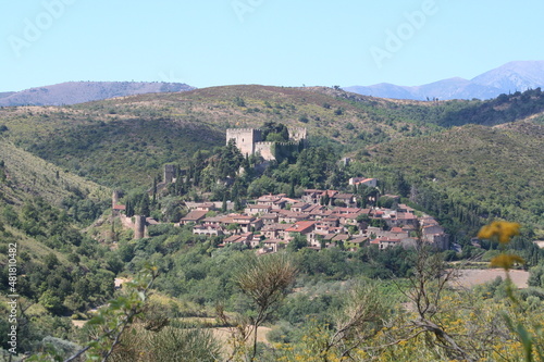 Landscape view of the beautiful medieval village of Castelnou in the Pyrenees Orientales region of France. © George Green