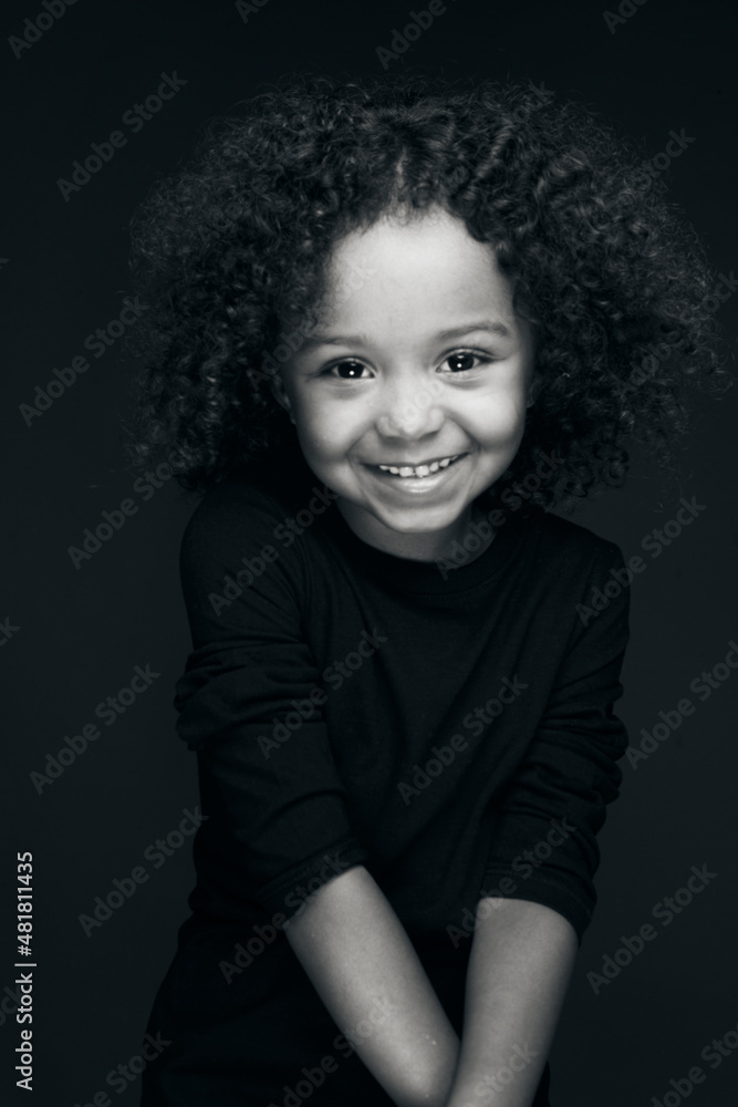 The natural beauty of a little girl under the effect of black and white and also the splendor of her color under the light of a studio decorated by her charm and her smile. The natural beauty of a little girl under the effect of black and white and also the splendor of her color under the light of a studio decorated by her charm and her smile.