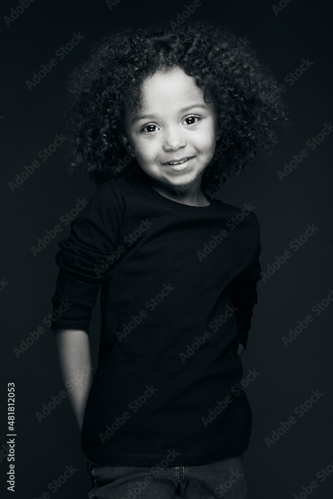 The natural beauty of a little girl under the effect of black and white and also the splendor of her color under the light of a studio decorated by her charm and her smile. The natural beauty of a little girl under the effect of black and white and also the splendor of her color under the light of a studio decorated by her charm and her smile.
