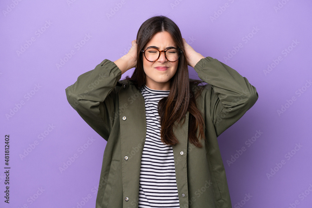 Young Brazilian woman isolated on purple background frustrated and covering ears Young Brazilian woman isolated on purple background frustrated and covering ears